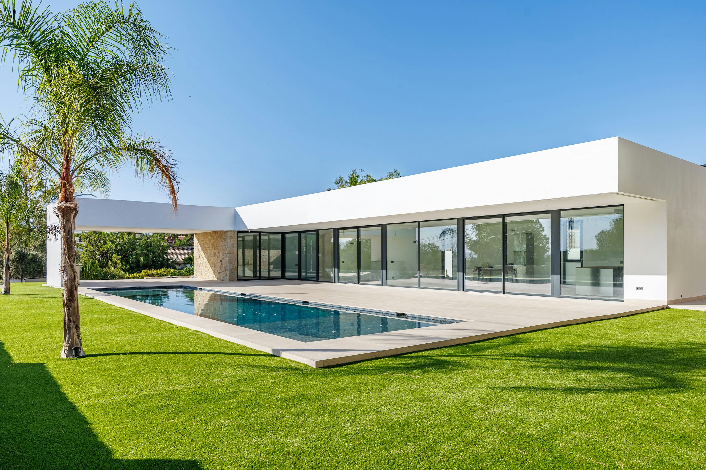 A welcoming contemporary home surrounded by greenery